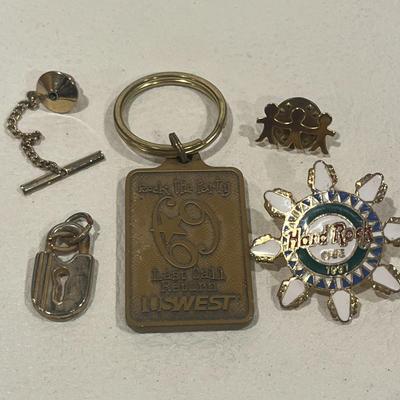 Various Pins, Buttons, Charms And Keychains