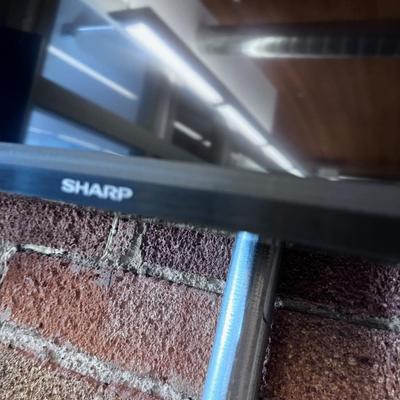 SHARP Television with Remote 61" Wall Mounted Bounce Main Room 1 