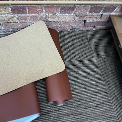 Pile of Desk Mats 