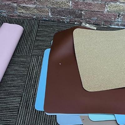 Pile of Desk Mats 