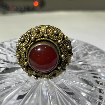 Vintage Sterling Silver Filigree Carnelian Ring with an Adjustable Shank in Good Preowned Condition.