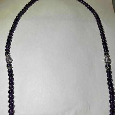 Vintage Amethyst Bead Stretch Necklace 28" Long in Very Good Preowned Condition.