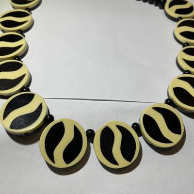Vintage Mid-Century Resin/Lucite Reversable Necklace 18" Long in Good Preowned Condition.