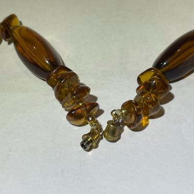 Vintage Mid-Century Amber Color Resin/Lucite Necklace 30" Long in Good Preowned Condition.
