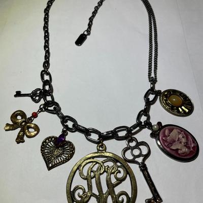 Vintage "Kissaka" Fashion Charm Necklace 17-20" Adjustable in Very Good Preowned Condition.