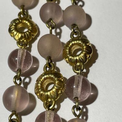 Vintage Preowned Gold-tone Triple Strand Pinkish Glass Bead Fashion Necklace 16-19" Adjustable in Very Good Preowned Condition.