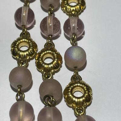 Vintage Preowned Gold-tone Triple Strand Pinkish Glass Bead Fashion Necklace 16-19" Adjustable in Very Good Preowned Condition.
