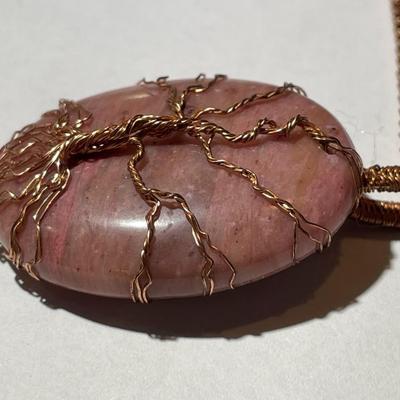 Vintage Rhodochrosite Crystal Tree of Life Pendant on a Copper 22" Chain in Good Preowned Condition as Pictured.