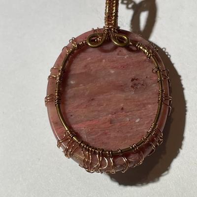 Vintage Rhodochrosite Crystal Tree of Life Pendant on a Copper 22" Chain in Good Preowned Condition as Pictured.