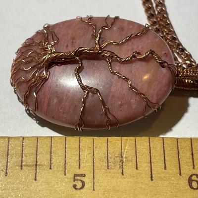 Vintage Rhodochrosite Crystal Tree of Life Pendant on a Copper 22" Chain in Good Preowned Condition as Pictured.
