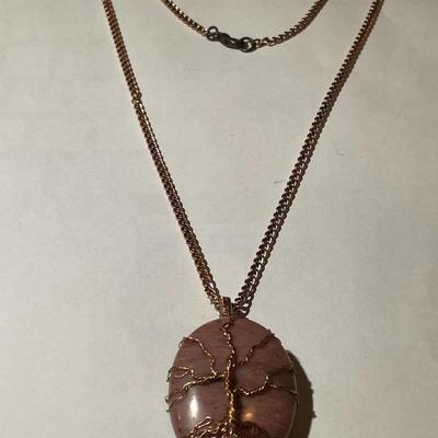 Vintage Rhodochrosite Crystal Tree of Life Pendant on a Copper 22" Chain in Good Preowned Condition as Pictured.