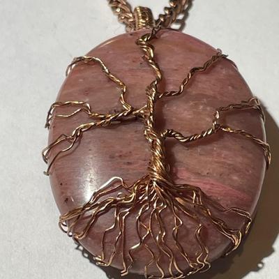 Vintage Rhodochrosite Crystal Tree of Life Pendant on a Copper 22" Chain in Good Preowned Condition as Pictured.
