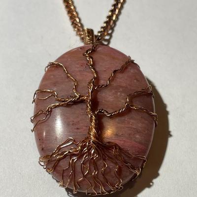 Vintage Rhodochrosite Crystal Tree of Life Pendant on a Copper 22" Chain in Good Preowned Condition as Pictured.