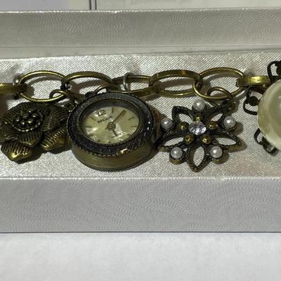 Vintage Mid-Century Antiqued Brass Charm Bracelet by Decade with Miscellaneous Charms as Pictured.