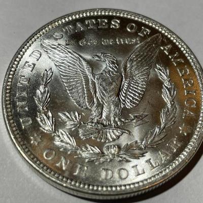 1921-P BRILLIANT UNCIRCULATED CONDITION MORGAN SILVER DOLLAR AS PICTURED.