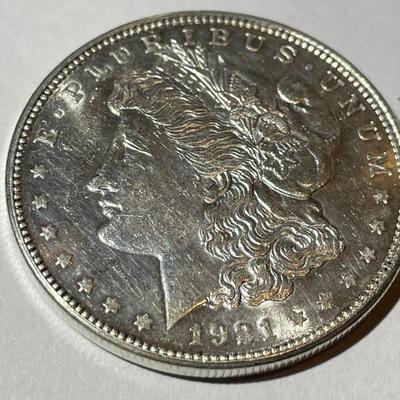 1921-D AU58 CONDITION MORGAN SILVER DOLLAR AS PICTURED.