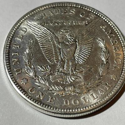 1921-D AU58 CONDITION MORGAN SILVER DOLLAR AS PICTURED.