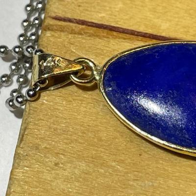 VINTAGE Dainty 14K Yellow Gold Lapis Pendant on a 16" Fashion White Metal Necklace in Very Good Preowned Condition as Pictured.