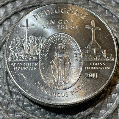 2011 MIRACULOUS MEDAL .999 FINE SILVER 1-OUNCE ROUND IN UNCIRCULATED CONDITION (COIN #7).