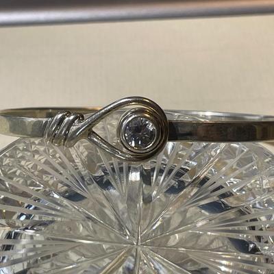 Vintage Sterling Silver CZ Standard Size Bangle Bracelet that Opens at the CZ in Good Preowned Condition.