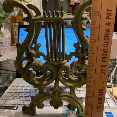Vintage Mid-Century Modern 11" Tall Cast Iron Magazine Rack in Good Preowned Condition.