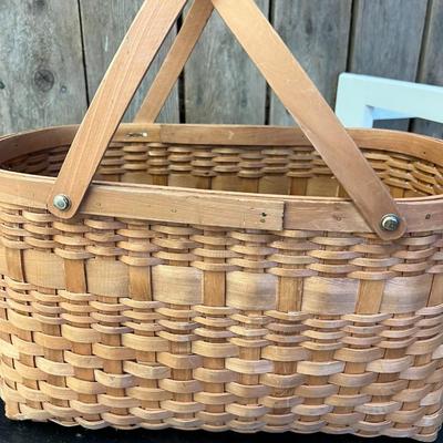 Two Mid Century Handwoven Rattan Handled Baskets