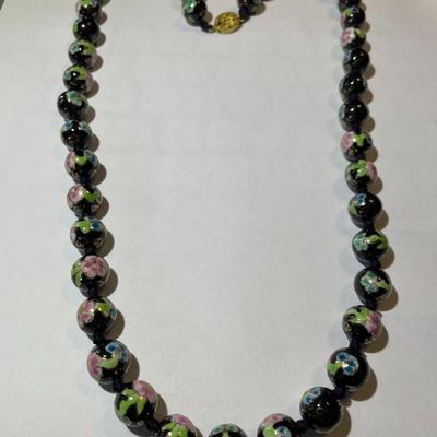 Vintage Asian Black Bead 24" Cloisonne Necklace Knotted with Mixed Color Flowers in VG Preowned Condition.