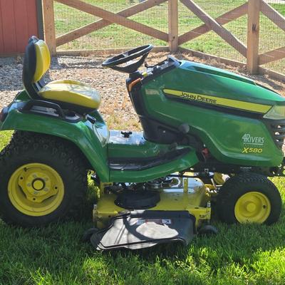 JOHN DEERE 4 Rivers X 580 with 54" Accel Deep Deck with John Deere Tiller, John Deere Snow Blower, and Yardworks Lawn Sweeper