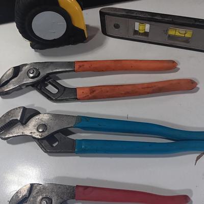 Assortment of piers - Rigid pipe wrench - tape measure and small level