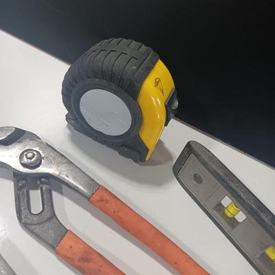 Assortment of piers - Rigid pipe wrench - tape measure and small level