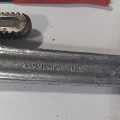 Assortment of piers - Rigid pipe wrench - tape measure and small level
