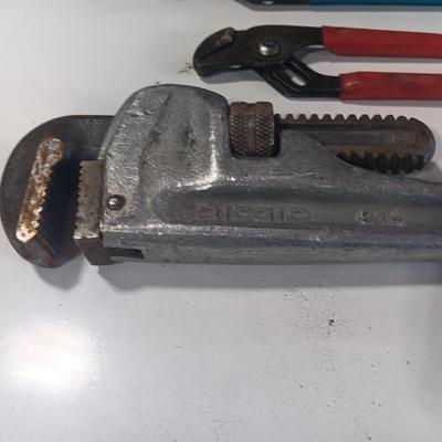 Assortment of piers - Rigid pipe wrench - tape measure and small level