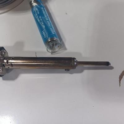 Rolls of Solder with Soldering Iron
