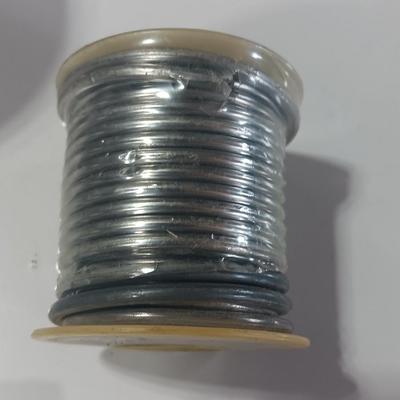 Rolls of Solder with Soldering Iron