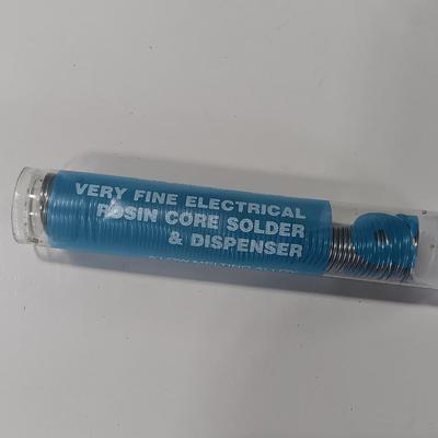 Rolls of Solder with Soldering Iron
