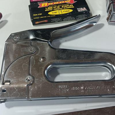 Leather punch = Staplers - and a hand saw