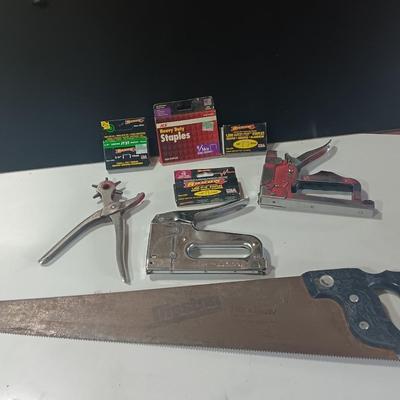 Leather punch = Staplers - and a hand saw