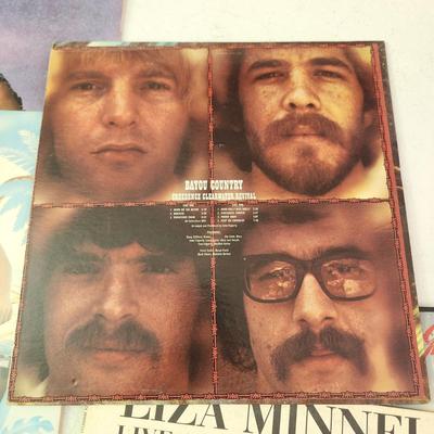 Record Albums Lot George Benson Barry Manilow Santana Righteous Brothers Olive Physical Bayou Country