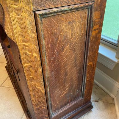 1900’s Singer Red Eye treadle sewing machine in tiger oak cabinet