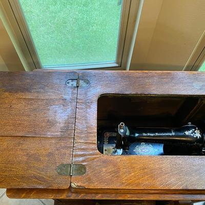 1900’s Singer Red Eye treadle sewing machine in tiger oak cabinet