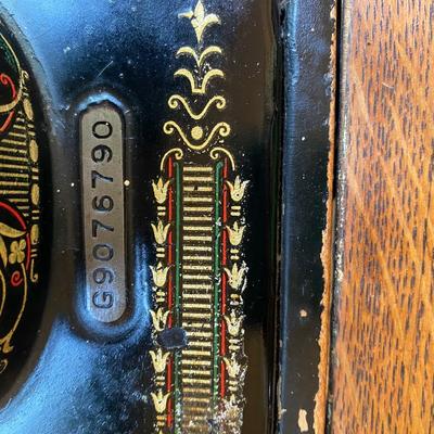 1900’s Singer Red Eye treadle sewing machine in tiger oak cabinet