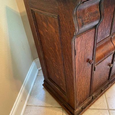 1900’s Singer Red Eye treadle sewing machine in tiger oak cabinet
