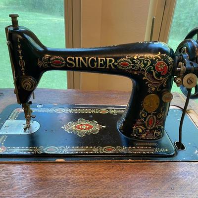 1900’s Singer Red Eye treadle sewing machine in tiger oak cabinet