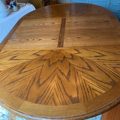 Beautiful vintage solid oak clawfoot pedestal dining table with one 24” leaf