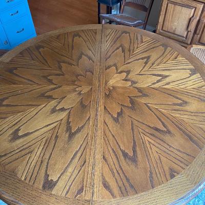 Beautiful vintage solid oak clawfoot pedestal dining table with one 24” leaf