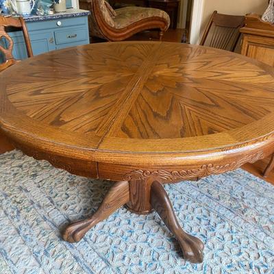 Beautiful vintage solid oak clawfoot pedestal dining table with one 24” leaf