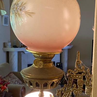 Antique wall-mounted oil lamp