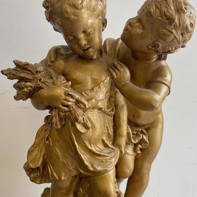 Large Gilt Coated Cherubs on a Stand