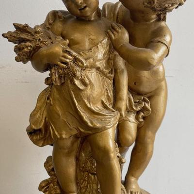 Large Gilt Coated Cherubs on a Stand