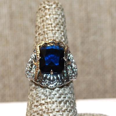 Size 7 Marked .925 Large Blue Radiant Cut Stone Ring on a Graphic Styled Flower Silver Band (5.4g)